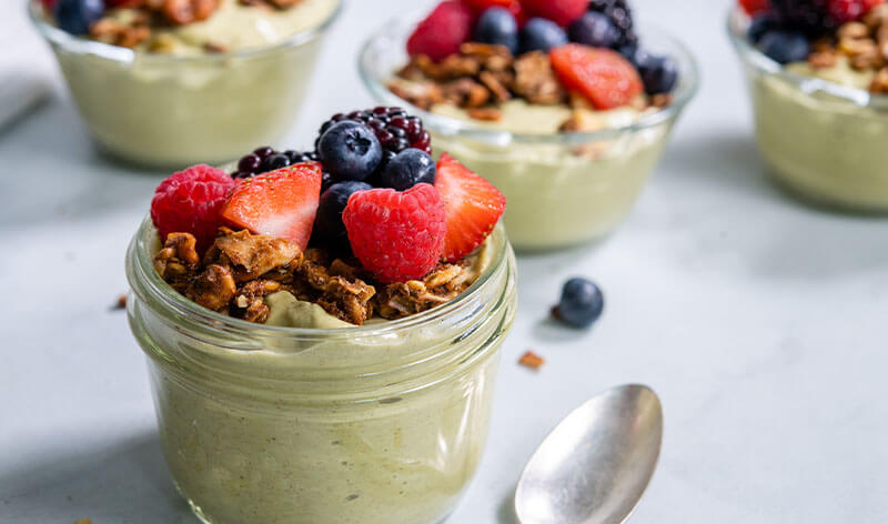 Avocado Vanilla Pudding with Mixed Berries and Peanut Butter Granola